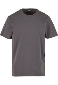 T-shirt gris à manches courtes en coton doux, avec un col rond et une coupe décontractée, dotée d'un ourlet droit. Aucun motif visible.