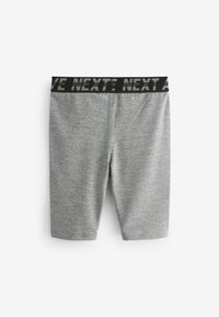 Grå sports-shorts med et tekstureret mønster, der har en bred sort talje med "NEXT" trykt med hvid skrift.