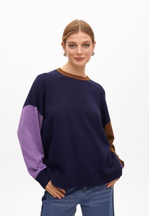 Navy blue sweater with purple and brown sleeves, crew neckline, and ribbed cuffs. Soft texture, casual fit, and minimalistic design.