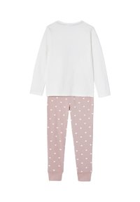 Pink pajama set featuring a long-sleeve white top and heart-patterned pants with ribbed cuffs. Fabric is soft, lightweight cotton.