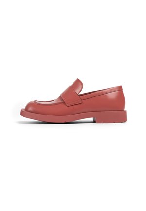 Red leather slip-on shoe with a rounded toe, a wide strap detail across the vamp, and a flat, textured rubber sole.