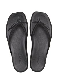 Infradito nere con suola texturizzata, cinturini flessibili e design liscio e minimale. Presenta il logo del marchio sulla suola.