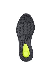 Zwarte rubberen schoenzool met een textuurpatroon voor grip. Voorzien van een opvallende groene dempingsinzet in een centraal ovale vorm.