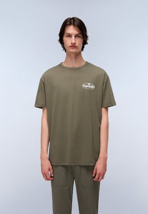 Olive green cotton t-shirt with a round neck and short sleeves, featuring a white logo print on the left chest. Smooth texture.