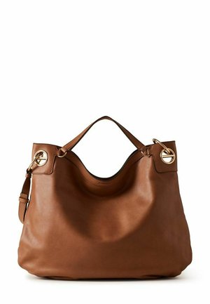 Sac à main en cuir marron avec deux anses, ferrures circulaires dorées de chaque côté, et une forme souple et décontractée sur fond blanc.