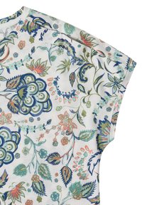 White fabric with blue, green, and coral floral and leaf patterns on a short-sleeve top, shown from the shoulder to the sleeve edge.