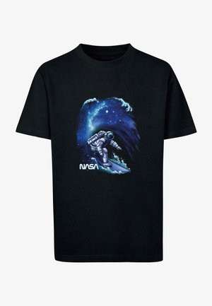 Black T-shirt featuring an astronaut surfing on a cosmic wave, with vibrant blue and purple galaxy designs and the "NASA" logo at the bottom.
