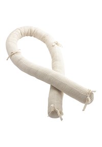 Woven fabric door draft stopper in cream color; cylindrical shape with ties for securing; textured surface, coiled design.