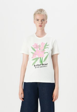 White cotton t-shirt featuring a floral design in pink and yellow, with green leaves, and the text "BLOSSOM BRIGHT AND JUST GROW WITH IT."