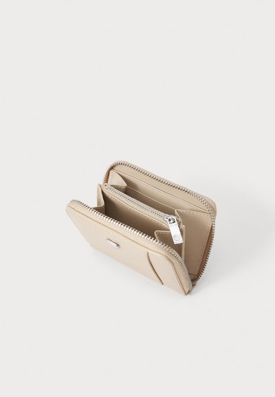 Beige leather wallet with a zip closure, featuring multiple card slots, a coin pocket, and a smooth texture with silver hardware accents.