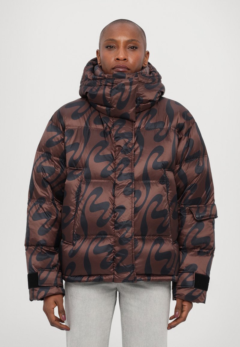 Padded brown jacket with a black abstract pattern, high collar, and elastic cuffs. Features a snug fit and a glossy, smooth texture.
