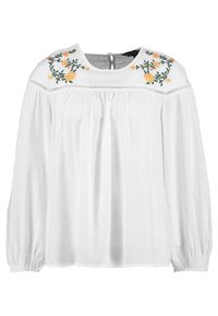 Blusa bianca con ricami floreali in tonalità di giallo e verde sulle spalle. Presenta un collo rotondo e maniche lunghe gather.