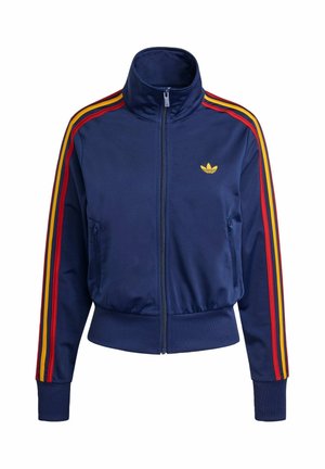 Jakna tamnoplave boje na patent zatvarač, napravljena od glatke tkanine, s prugastim crvenim, žutim i narančastim detaljima na rukavima i zlatnim logotipom na prsima.