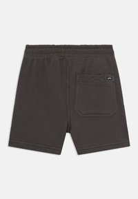 Mörkgrå shorts i mjukt material, med resårmidja, bakficka med en geometrisk söm och rena kanter.