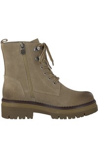 Bottines en suède beige avec un bout rond, un laçage à l'avant, une fermeture éclair sur le côté et une semelle en caoutchouc épaisse. Comprend des œillets en métal et un contraste de textures.