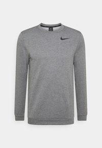 Grijze sweatshirt van een zachte stof, met een ronde hals, lange mouwen en een klein zwart Nike-logo op de linkerborst.