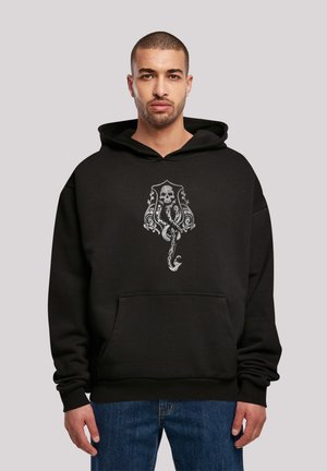 Svart hettegenser laget av bomullsblanding, med et sentralt grafisk motiv av et hodeskalle med et blekksprutdesign. Kenguro-lomme og ribbede ermer.