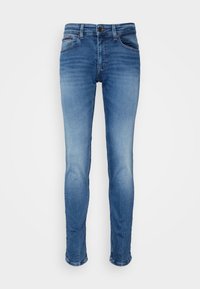 Mörkblå skinny jeans av denim med midjemått i midjan, fem fickor och subtila blekningar, med en klassisk rak benmodell.