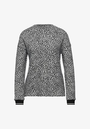 Suéter gris con un patrón de manchas negras, cuello redondo, mangas largas y puños acanalados negros con rayas blancas. Textura suave.