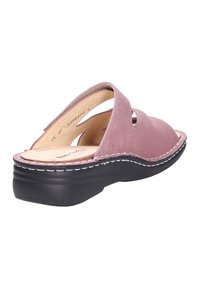 Mauve suede open-back sandal with cushioned beige insole, two cut-out straps, and a black, slightly elevated sole with white stitching.