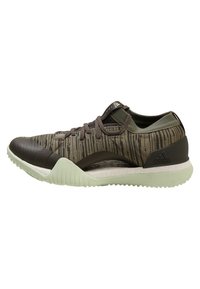 Scarpe sportive nere e verdi con una parte superiore testurizzata, caratterizzate da un design a motivi, lacci rotondi e una suola verde chiaro.