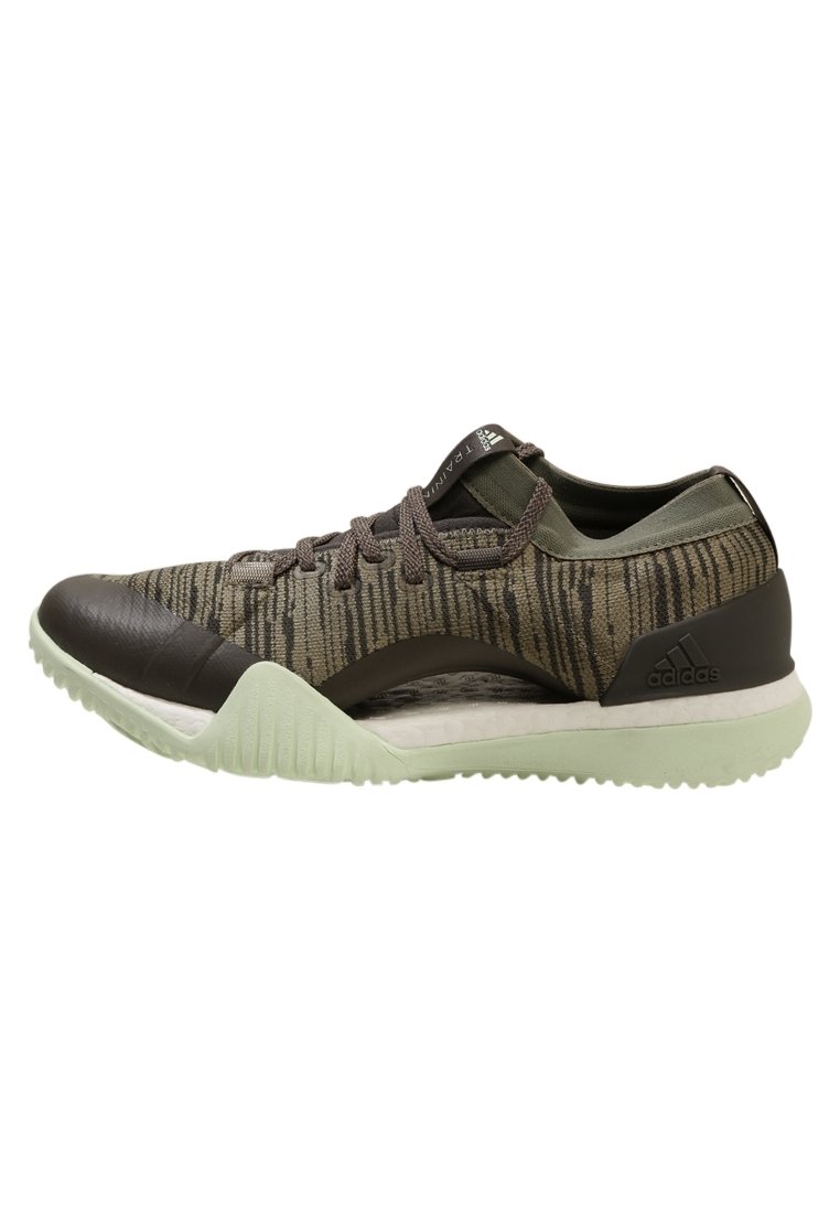 Scarpe sportive nere e verdi con una parte superiore testurizzata, caratterizzate da un design a motivi, lacci rotondi e una suola verde chiaro.