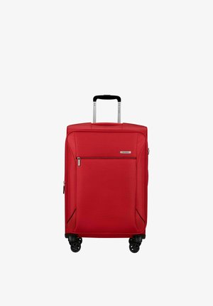 Red soft-sided suitcase with front zip pocket, telescoping handle, and four black spinner wheels on a white background.