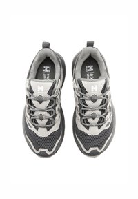 Grey and black athletic shoes with mesh upper, rubber sole, and padded collar. Features multiple lace eyelets and logo on tongue and side.