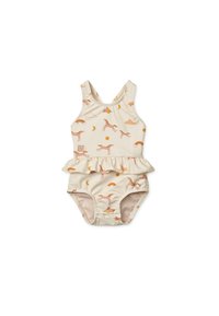 Maillot de bain crème avec une jupe à volants, arborant un motif ludique de chiens roses, de nuages, de soleils et d'arc-en-ciel dans des couleurs pastel douces.
