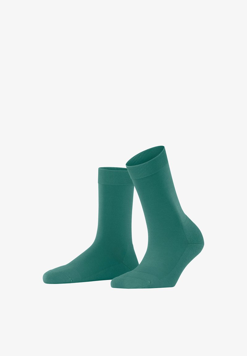 Türkise Baumwollsocken mit gerippten Bündchen, mittellang, glatte Textur und verstärktem Zehenbereich. Geeignet für legere und formelle Anlässe.