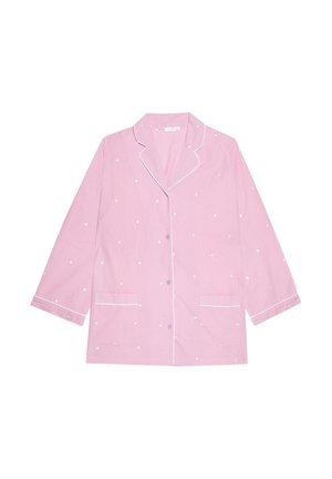 Top da pigiama rosa chiaro con pois bianchi circolari, colletto a punta, maniche lunghe, due tasche frontali e piping bianco lungo i bordi.
