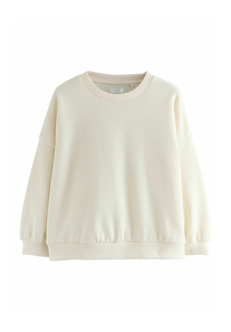 Ljuscremefärgad sweatshirt gjord av textil med struktur. Har en rund krage och lång ärm med samlade manschetter samt en figurnära nederkant.
