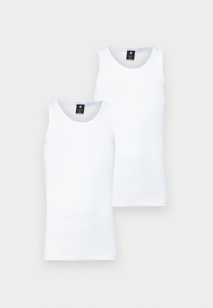 Two white, sleeveless tank tops made from a soft, lightweight material. Features a round neckline and a clean, simple design.