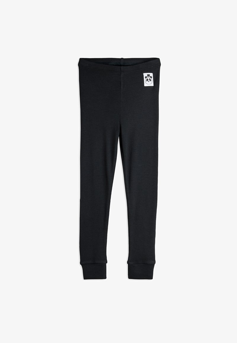 Sorte ripede leggings med oppbrettede ankler og en liten hvit lapp med et pandaansikt nær livlinjen på hvit bakgrunn.
