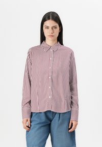 Striped button-up shirt in burgundy and white, featuring long sleeves, a classic collar, and a curved hem. Made from lightweight fabric.