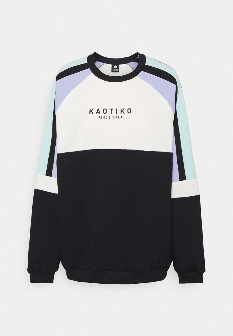 T-paita crewneck kanssa musta, valkoinen, minttuvihreä ja laventeli paneelit. Sisältää "KAOTIKO" logon ja kontrastiväriset ribbikuitut.