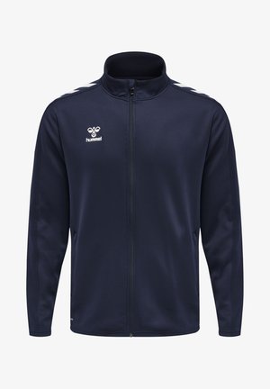 Marineblaue Zip-Jacke aus glattem Polyesterstoff. Mit weißen Akzentstreifen auf den Schultern und einem kleinen Logo auf der Brust.
