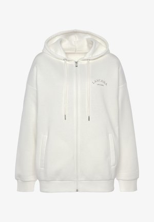 Witte rits-hoodie gemaakt van zachte stof, met een grote capuchon, voorzakken en lichtbeige logo-tekst op de borst.
