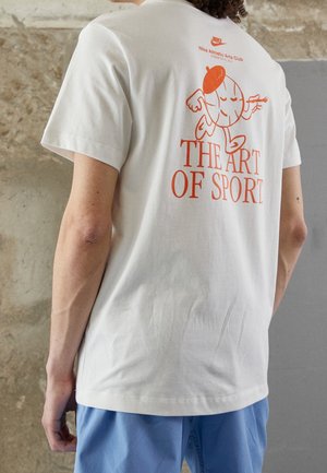 White cotton t-shirt featuring a red graphic illustration of a character and the text "THE ART OF SPORT" on the back. Short sleeves.