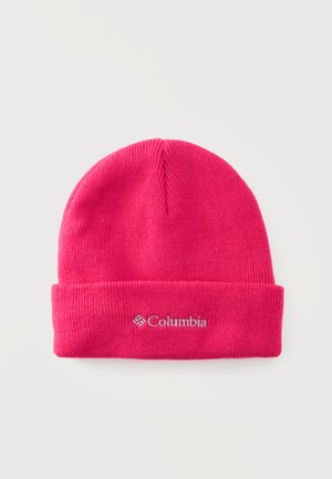 Bonnet tricoté rose vif avec revers plié et logo de la marque Columbia blanc brodé au centre devant.