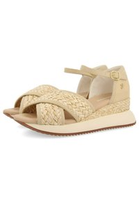 Sandalias de palma tejida en beige con tiras cruzadas, correa en el tobillo con hebilla y una suela de plataforma baja y texturizada.