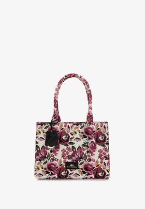 Le sac fourre-tout floral présente un motif de roses roses et noires sur un fond clair, avec des poignées robustes et une étiquette d'accent noir.
