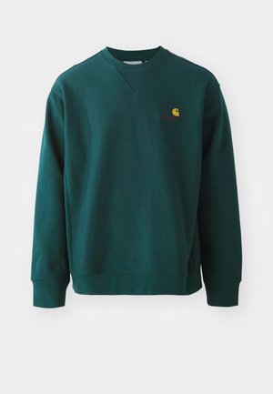 Dark green sweatshirt made of cotton, featuring a ribbed crew neckline, long sleeves, and a small Carhartt logo on the chest.