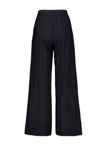 Pantalons larges noirs avec une taille élastique, présentant une texture lisse et une coupe décontractée. Sans poches ni embellissements supplémentaires.
