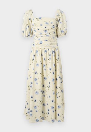 Blomster midi-kjole i lys gul med blå blomstermønstre. Har puffærmer og en tætsiddende overdel med indsamlet detaljering.