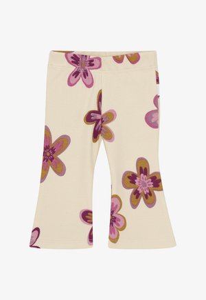 Crème-kleurige ribstof broeken met uitlopende pijpen, versierd met grote roze en bruine bloemmotieven.
