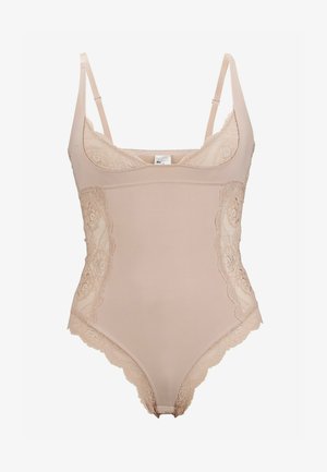 Nude bodysuit gemaakt van zachte stof, met kant langs de randen, dunne verstelbare bandjes en een ronde halslijn.