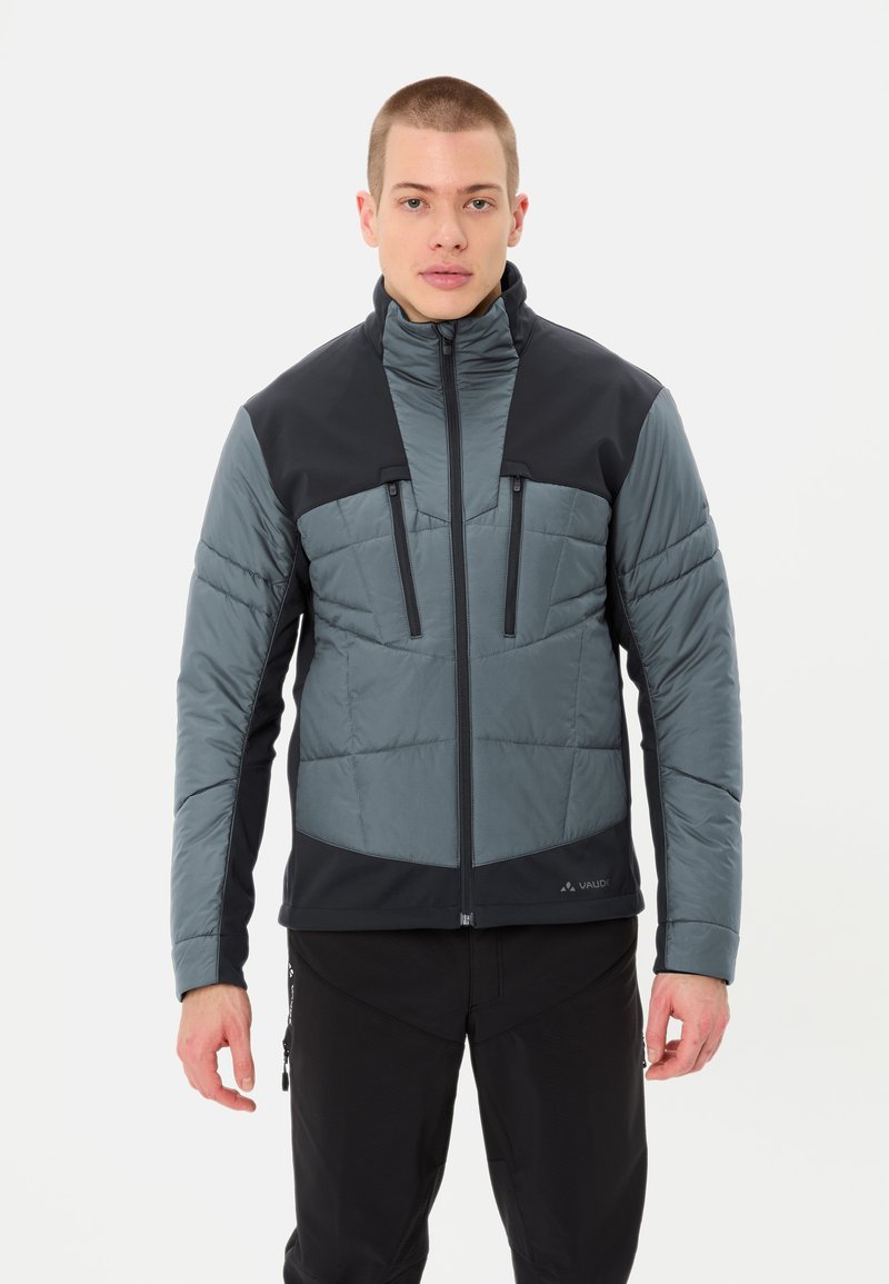 Giacca imbottita con parte superiore grigio scuro e pannelli inferiori grigio chiaro, dotata di tasche sul petto con zip e un collo alto per garantire calore.