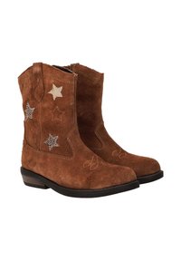 Bruine suède cowboylaarzen met sterpatronen en contrasterende stiksels. Ronde neus, lage hak en ritsluiting. Soepele textuur.