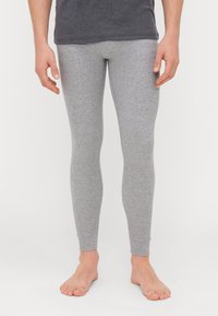Világosszürke pamut leggings, karcsú szabással, sima textúrával és boka hosszal, alap derékpánttal és látható fémalkatrészek nélkül.